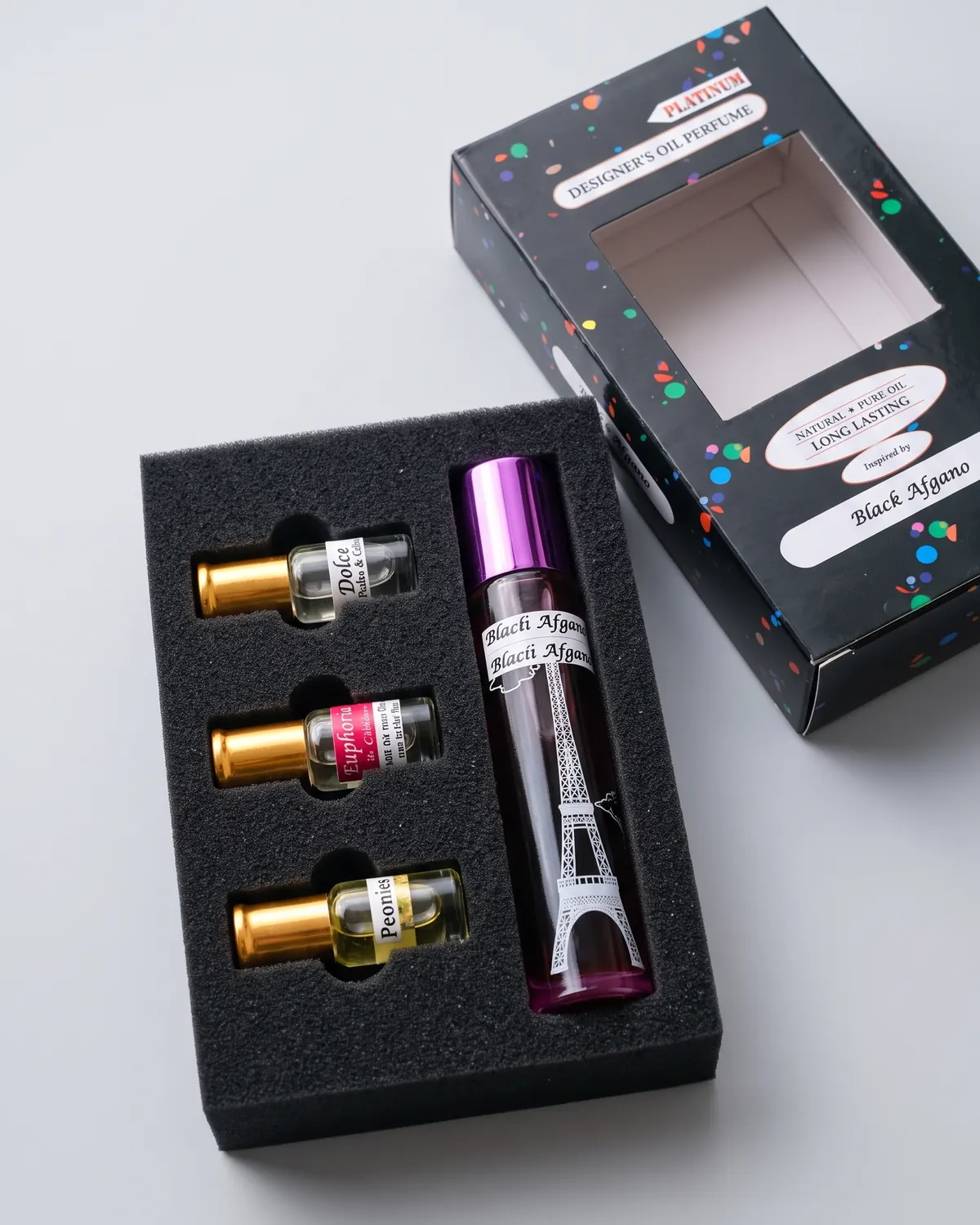 A large bottle of perfume oil in a foam tray, with its printed Platinum box behind